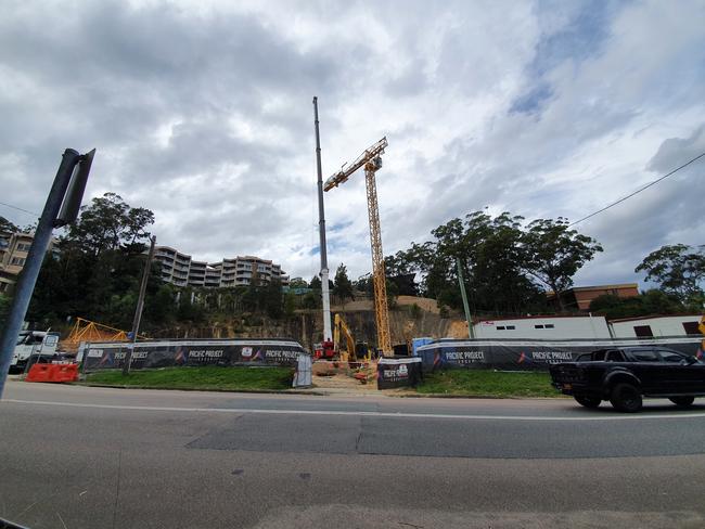 A crane has arrived at Gosford's notorious hole in the ground along Henry Parry Drive. Picture: Fiona Killman