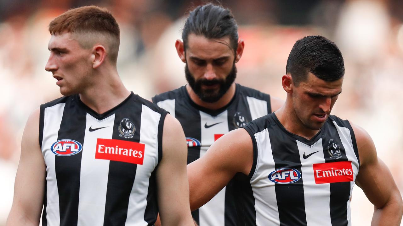 MELBOURNE, AUSTRALIA - MAY 01: (L-R) Mark Keane, Brodie Grundy and Scott Pendlebury of the Magpies look on during the 2021 AFL Round 07 match between the Collingwood Magpies and the Gold Coast Suns at the Melbourne Cricket Ground on May 01, 2021 in Melbourne, Australia. (Photo by Michael Willson/AFL Photos via Getty Images)