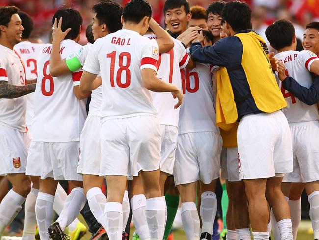 CANBERRA, AUSTRALIA - JANUARY 18: Sun Ke of China celebrates with team mates after scoring a goal during the 2015 Asian Cup match between China PR and DPR Korea at Canberra Stadium on January 18, 2015 in Canberra, Australia. (Photo by Mark Nolan/Getty Images)