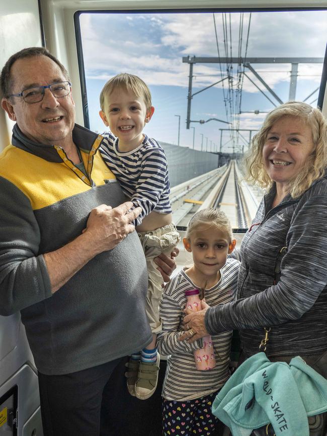 Gary and Lyn Pearce from Bella Vista with Fynn and London Copman from Kellyville on the new Sydney Metro line. Picture: David Swift