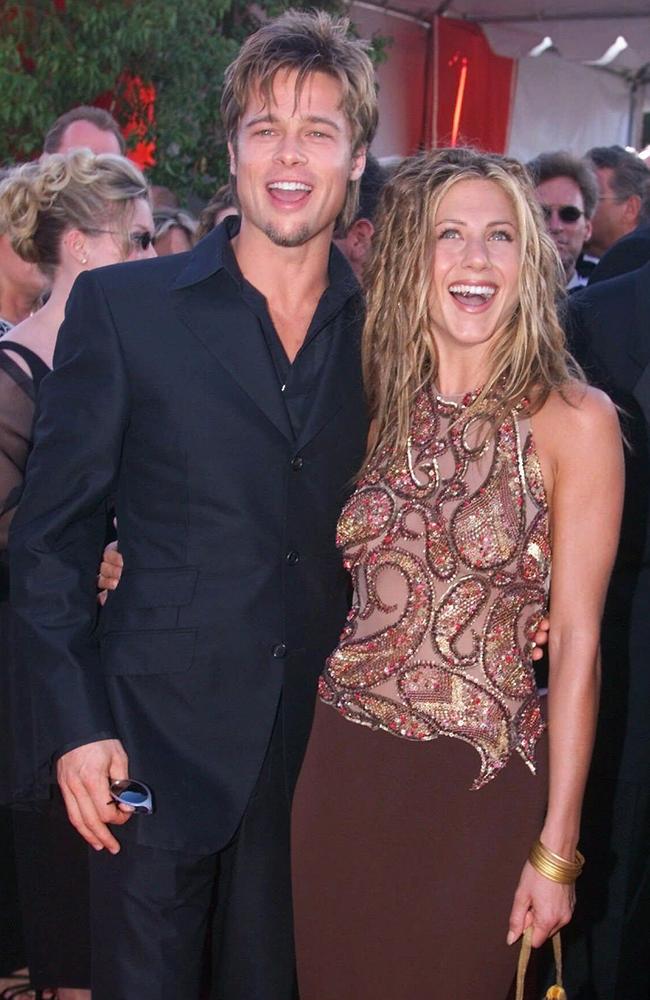 Jennifer Aniston, right, wearing a beaded Randolph Duke gown with her then-husband Brad Pitt at the Emmys in 1999. Picture: News Corp Australia