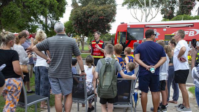 MFB Assistant Chief Fire Officer Tim Landells speaks to parents and students after the blaze. Picture: Sarah Matray