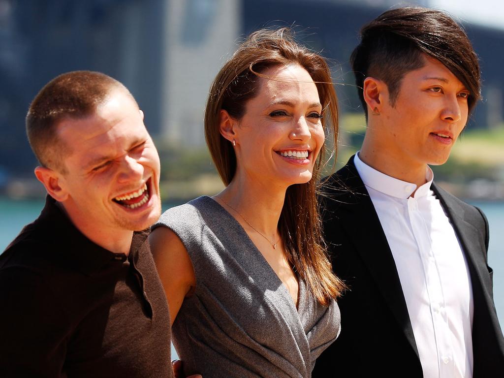 Jack O’Connell, Angelina Jolie and Miyavi Ishihara share a joke at the photo call of Unbroken at Sydney Opera House on November 18, 2014 in Sydney, Australia. Picture: Getty