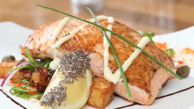 Le Vintage Boutique Cafe’s Seared Atlantic salmon served on crispy smashed potatoes with a light rocket, Spanish onion and caper salad. Pic by Richard Gosling