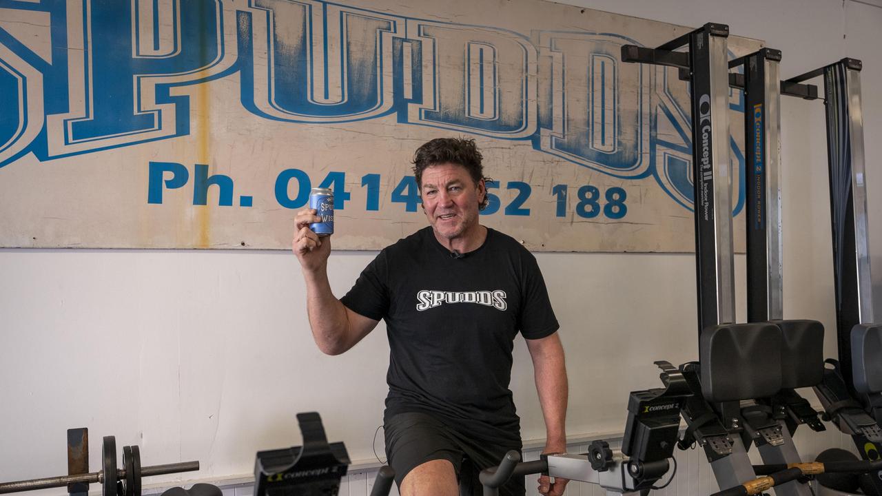 Mark "Spudd" Carroll with his new beer called "Spudd Wiser" at his gym in Sydney. Picture: Ryan Osland