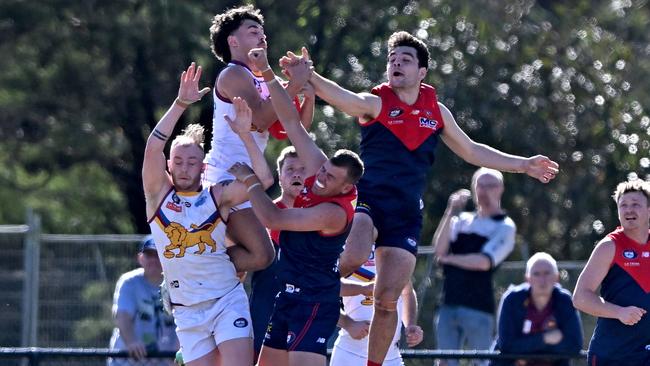 Diamond Creek and South Morang players fly for the mark. Picture: Andy Brownbill