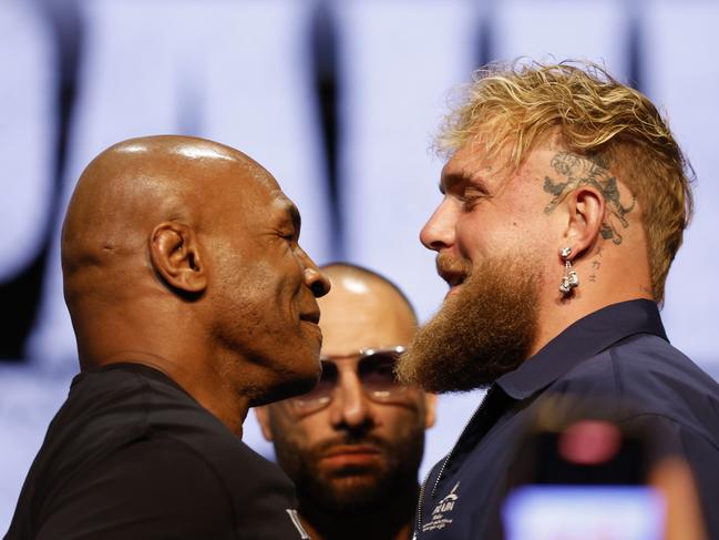NEW YORK, NEW YORK - MAY 13: (L-R) Mike Tyson and Jake Paul speak onstage at the press conference in promotion for the upcoming Jake Paul vs. Mike Tyson boxing match at The Apollo Theater on May 13, 2024 in New York City. (Photo by Sarah Stier/Getty Images for Netflix)