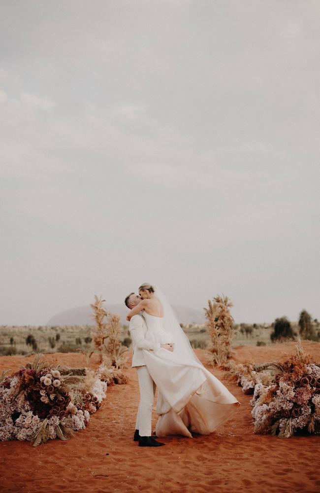 Abbey Holmes and Keegan Brooksby wed at Uluru. Picture: Lilly at Dawn