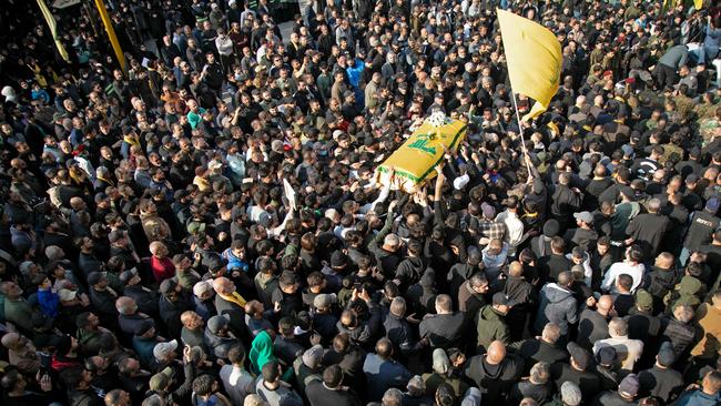 Mourners attend the funeral of Hezbollah fighter Hassan Salame, while a United Nations official called for an end to the "dangerous cycle of violence". Picture: AFP