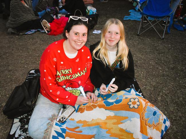 Lily and Amber getting festive at the Phillip Island Christmas Carols by the Bay at the Cowes Foreshore on Tuesday, December 10, 2024. Picture: Jack Colantuono