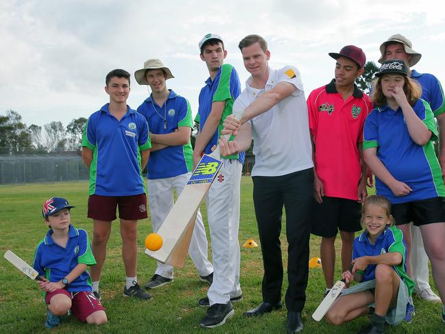 Steve Smith with kids at Blowfly Cricket Club who have learning difficulties. Picture: Adam Ward