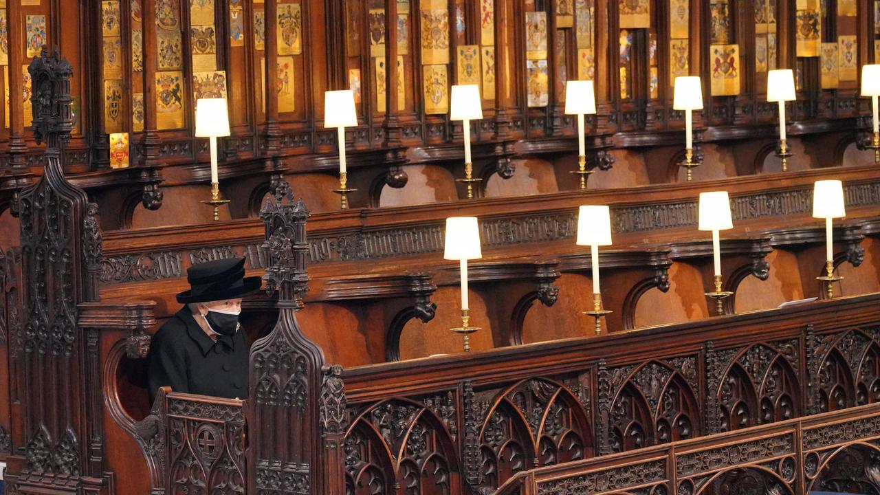 Queen Elizabeth II takes her seat during the funeral of Prince Philip, Duke of Edinburgh, at St George's Chapel at Windsor Castle. Picture: Getty