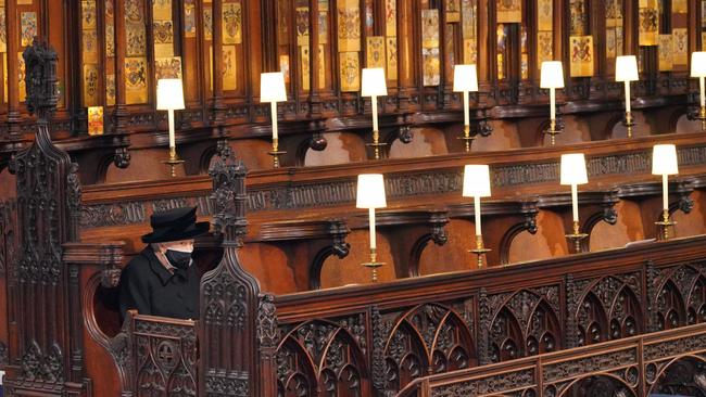 Queen Elizabeth II takes her seat during the funeral of Prince Philip, Duke of Edinburgh, at St George's Chapel at Windsor Castle. Picture: Getty