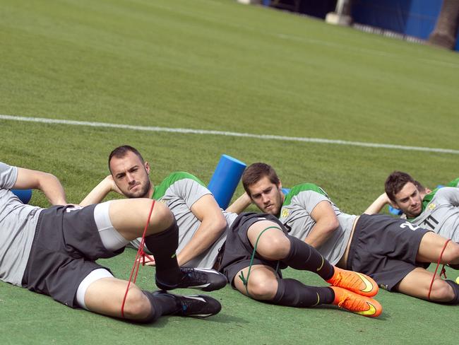 Australian 'Socceroos' players take part in a football training session at the Central Coast Stadium in Gosford on May 18, 2014. IMAGE RESTRICTED TO EDITORIAL USE - STRICTLY NO COMMERCIAL USE-- AFP PHOTO / SAEED KHAN