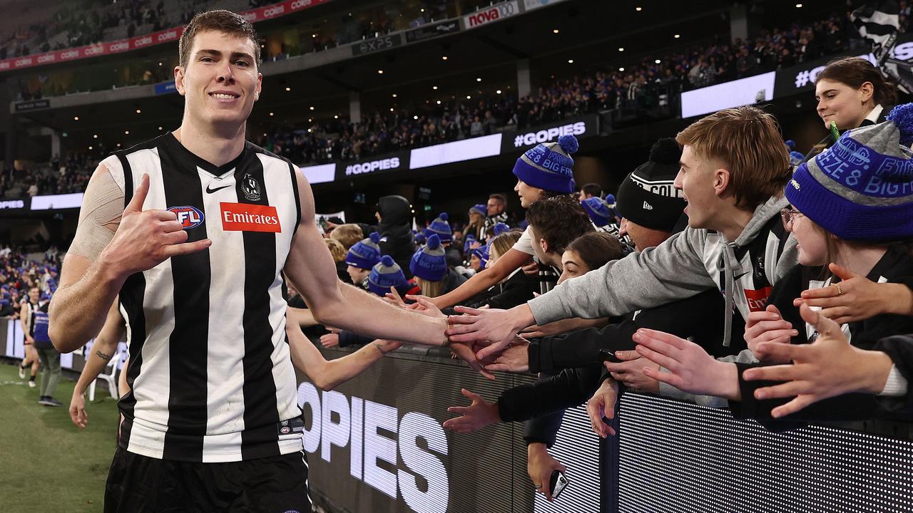 Mason Cox celebrates with fans after the thrilling win over Melbourne on Monday. Picture: Michael Klein