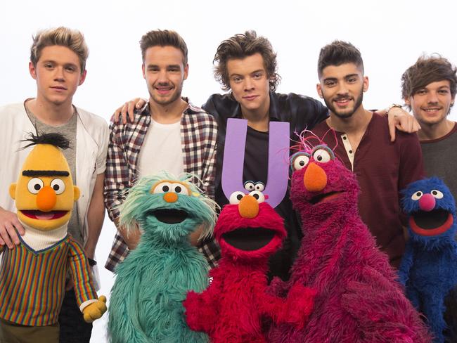 Sesame Street favourite Elmo and friends with One Direction. Picture: Richard Termine