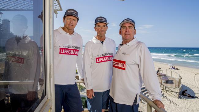 Veteran Gold Coast lifeguards Peter Ball, Scott Franzmann and Anthony Lunney atop the tower at Burleigh Heads beach. Picture: Jerad Williams