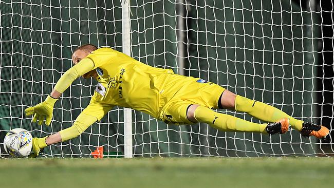 Sydney FC goalkeeper Andrew Redmayne saves Crio O’Hare’s penalty. Picture: Getty Images