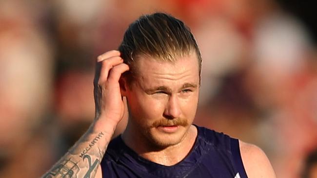 SYDNEY, AUSTRALIA - AUGUST 12: Cam McCarthy of the Dockers and Matt Taberner of the Dockers look dejected after losing the round 21 AFL match between the Sydney Swans and the Fremantle Dockers at Sydney Cricket Ground on August 12, 2017 in Sydney, Australia.  (Photo by Cameron Spencer/Getty Images)