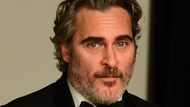 US actor Joaquin Phoenix poses in the press room with the Oscar for Best Actor for "Joker" during the 92nd Oscars at the Dolby Theater in Hollywood, California on February 9, 2020. (Photo by FREDERIC J. BROWN / AFP)