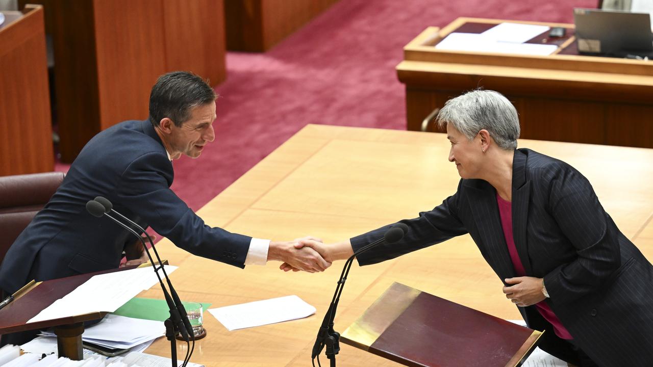 Senator Penny Wong congratulates Senator Simon Birmingham after his valedictory speech in the Senate on Thursday. Picture: NewsWire / Martin Ollman