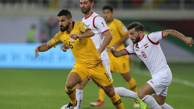 Aziz Behich of Australia challenged by Mahmoud Almawas of Syria. Picture: Getty