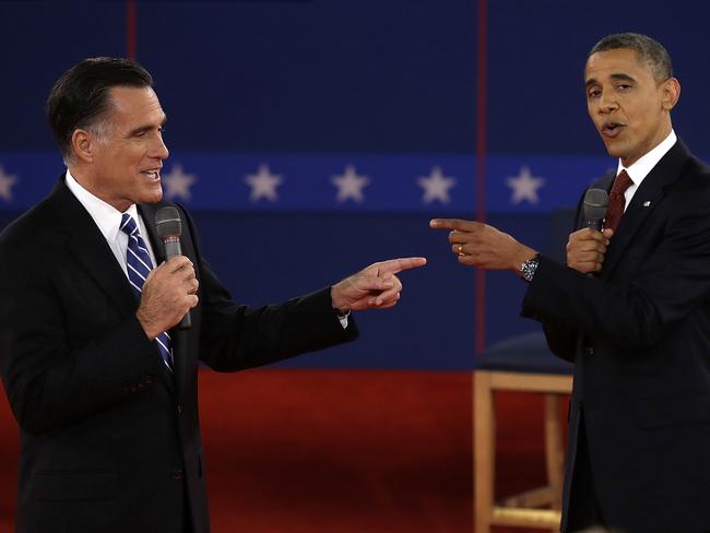 FOR USE AS DESIRED, YEAR END PHOTOS - FILE - In this Oct. 16, 2012 file photo, Republican presidential nominee Mitt Romney, left, and President Barack Obama spar during the second presidential debate at Hofstra University in Hempstead, N.Y. (AP Photo/Charlie Neibergall, File)