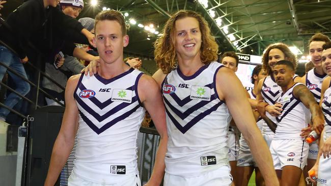 MELBOURNE, AUSTRALIA - JULY 09: Ryan Nyhuis of the Dockers and Nat Fyfe of the Dockers celebrate as they leave the field after winning the round 16 AFL match between the North Melbourne Kangaroos and the Fremantle Dockers at Etihad Stadium on July 9, 2017 in Melbourne, Australia. (Photo by Scott Barbour/Getty Images)