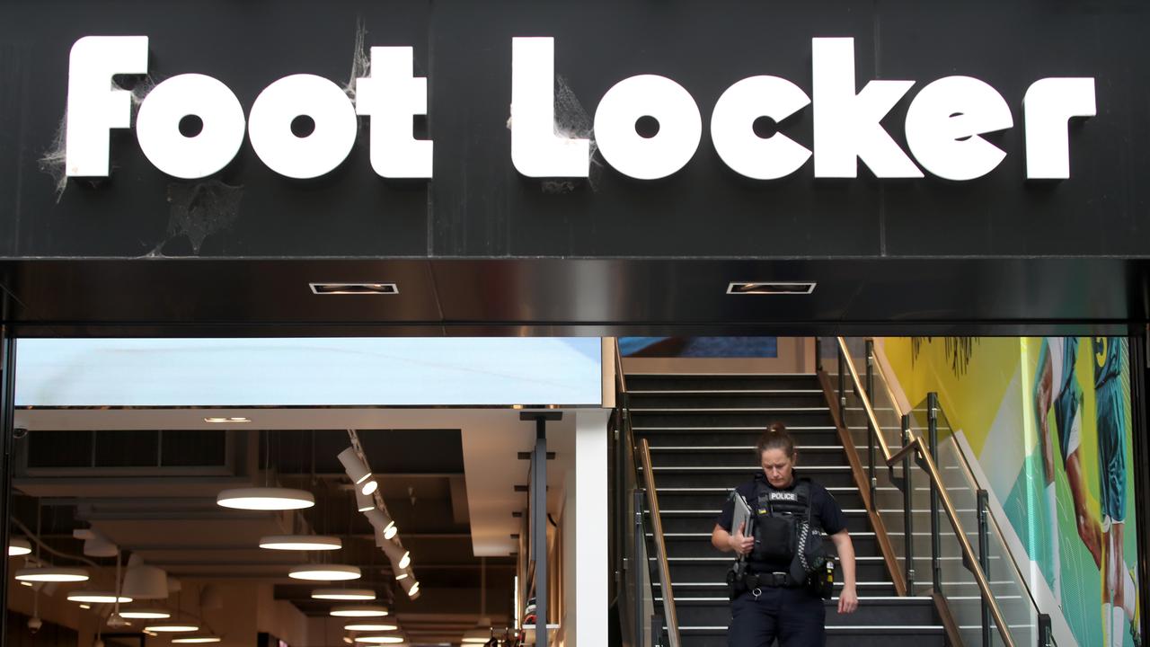 Police at the Rundle Mall Footlocker store after thieves threatened staff with an axe and stole goods. Picture: Kelly Barnes