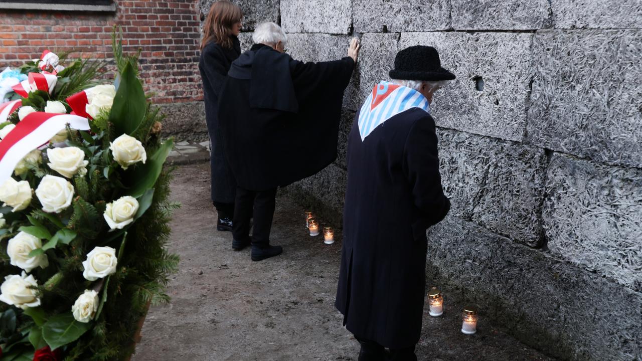 People arrive for a memorial in the Auschwitz I former concentration camp site on the 80th anniversary of the liberation of the camp in Oswiecim, Poland. Picture: Sean Gallup/Getty Images