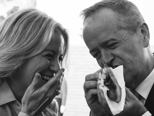 Then-Australian Opposition Leader Bill Shorten and his wife Chloe eat a democracy sausage after casting their votes in the 2019 Federal Election. Picture: AAP Image/Lukas Coch.