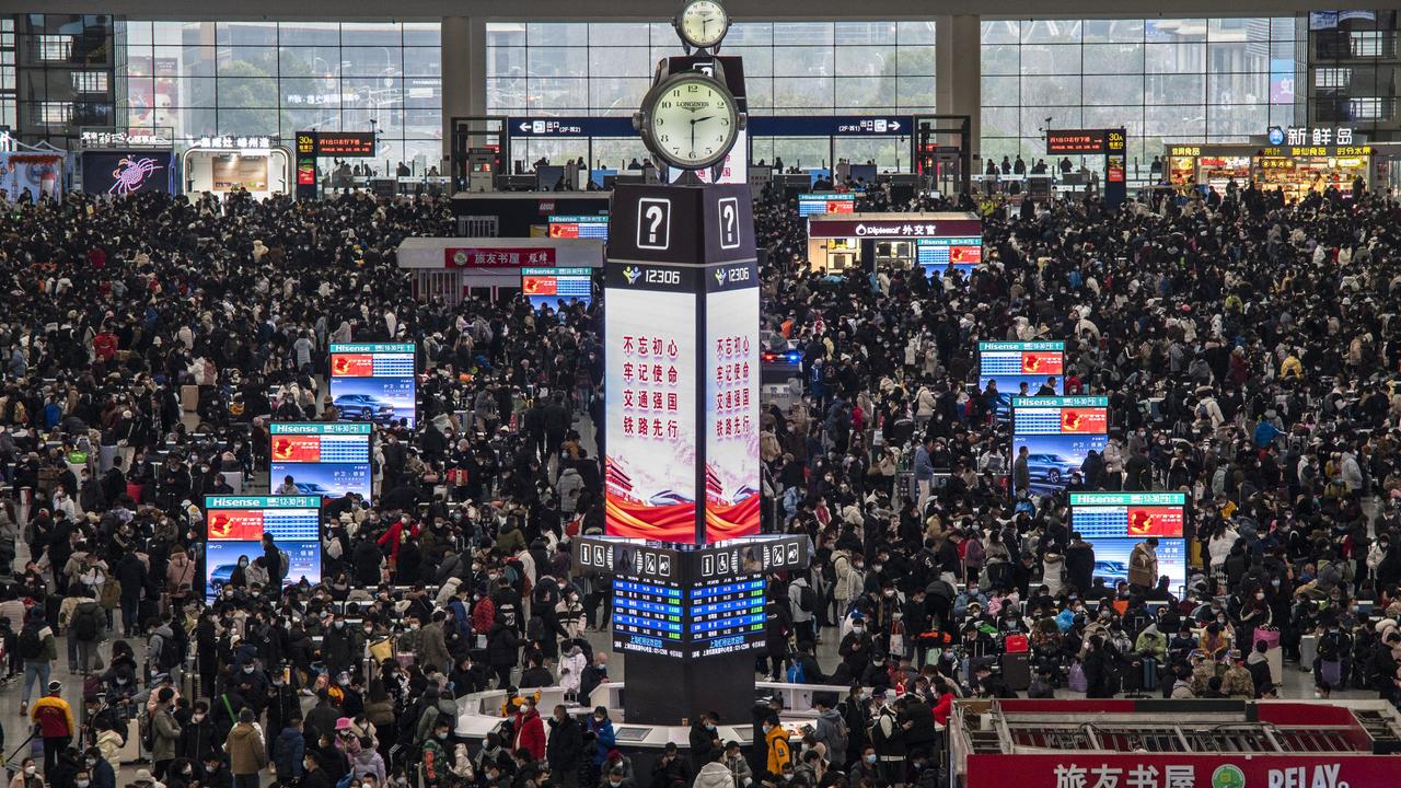 Chinese travellers wait for trains in Shanghai on January 15 ahead of Chinese New Year – a very different scene to just a few months before. Picture: Kevin Frayer/Getty Images