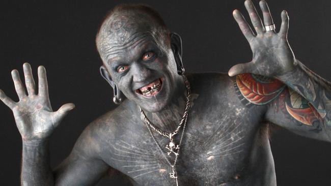 Amazing modifications: horns, fangs and whole body tattoos.