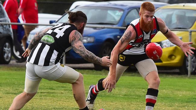 Rockbank’s Aiden O’Neil tries to gather the ball against Wallan on Saturday. Picture: Dennis Manktelow