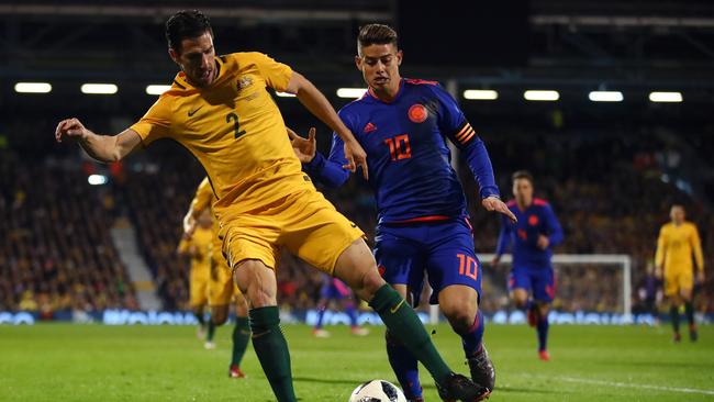 Australia’s Milos Degenek is challenged by Colombia’s James Rodriguez during their friendly match in London in March. Picture: Getty Images