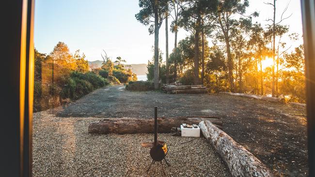 Tiny Away's newest tiny home Pirates Retreat is nestled on a hill that is surrounded by trees and overlooks the ocean at Eaglehawk Neck. Photo: Supplied by Tiny Away