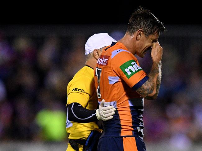 Mitchell Pearce leaves the field in the game against the Tigers. Pic: AAP