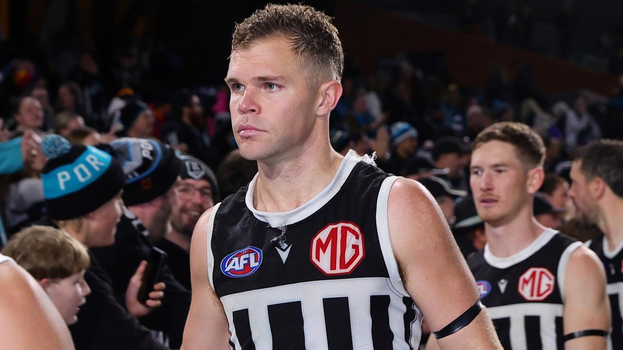 ADELAIDE, AUSTRALIA - AUG 17: Dan Houston of the Power with fans after the win during the 2024 AFL Round 23 match between the port Adelaide Power and the Adelaide Crows at Adelaide Oval on August 17, 2024 in Adelaide, Australia. (Photo by Sarah Reed/AFL Photos via Getty Images)