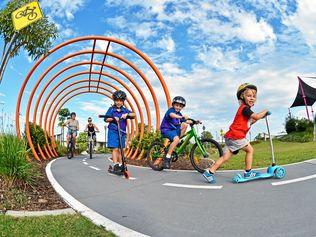 ON A ROLL: Out enjoying Pedal Park at Aura are Freddy, 3, (red top), Quinn, 6 (scooter), Donna Odell (mum black top), with Alex and Layklan Selkrig, 5 (green bike). Picture: Patrick Woods