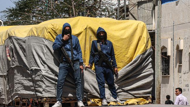 Members of the so-called People's Protection Committees guard an aid truck in Rafah in the southern Gaza Strip this week. Picture: AFP