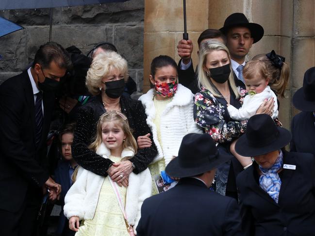 Bert’s family outside as his coffin is taken away. Picture: Matrix