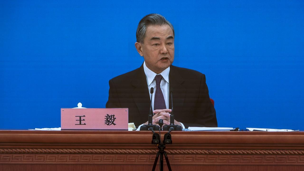 Chinese Foreign Minister Wang Yi is seen on large screens as he holds a press conference at the Media Center on March 07, 2022 in Beijing, China. Picture: Andrea Verdelli/Getty Images