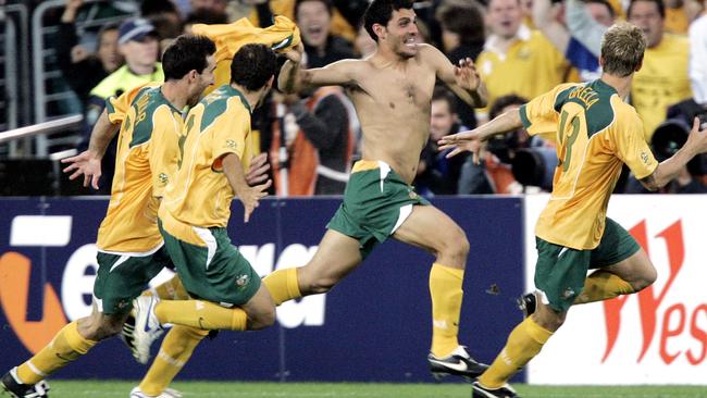 John Aloisi leads the Socceroos’ celebrations after qualifying for the 2006 World Cup.