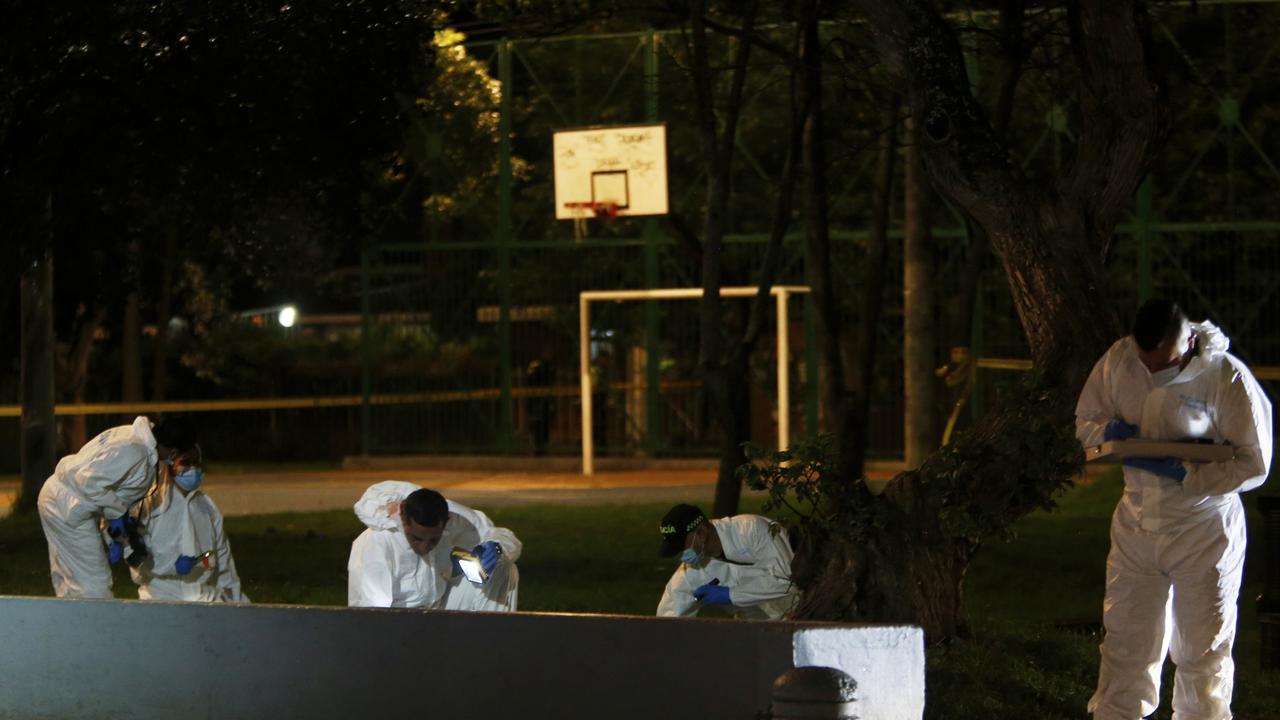 Investigators inspect the scene where he was shot. Picture: AP Photo/Jhon Wilson Vizcaino