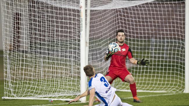 Thunder's Jace Hudson stops this shot at goal by Michael Thwaite, Gold Coast. NPL, South West Thunder vs. Gold Coast United.