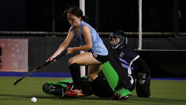 Cairns Hockey preseason women's game between All Stars and Cairns Storm. Storm's Reese Pointing and All Stars' keeper Milogros Arrotea Molina. PICTURE: STEWART MCLEAN