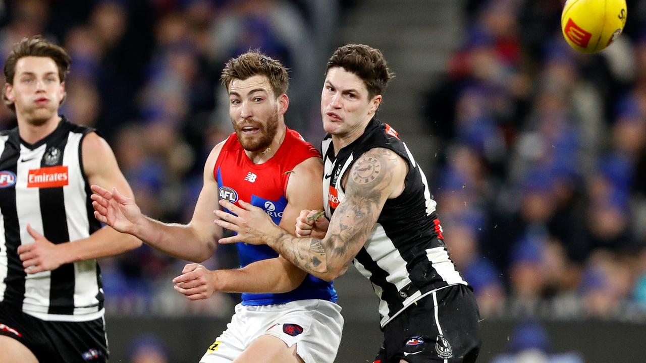 Jack Viney under pressure from Jack Crisp. Picture: Dylan Burns/AFL Photos via Getty Images