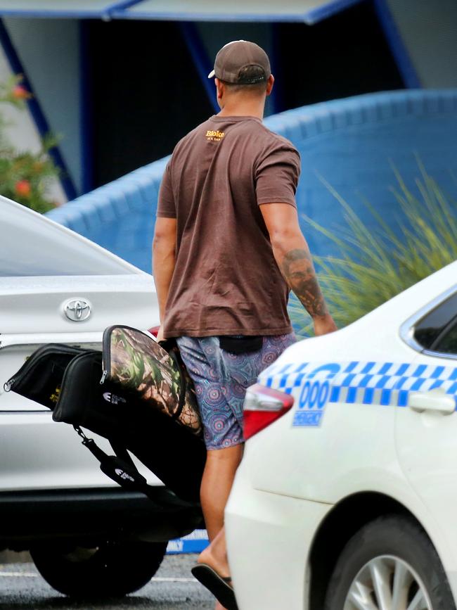 Mitchell surrendering his firearms at Taree Police Station. Picture: Nathan Edwards