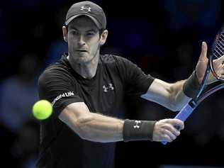 Britain's Andy Murray returns the ball against Milos Raonic of Canada at the ATP World Tour Finals at the O2 Arena in London. Picture: WILL OLIVER