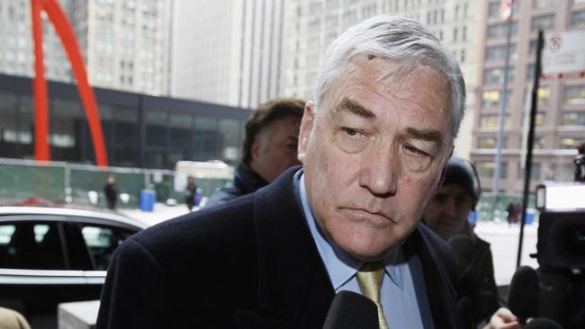 FILE - In this Jan. 13, 2011 file photo, Conrad Black arrives at the federal building in Chicago. President Donald Trump has granted a full pardon to Black, a former newspaper publisher who has written a flattering political biography of Trump. Black's media empire once included the Chicago Sun-Times and The Daily Telegraph of London. (AP Photo/Charles Rex Arbogast, File)